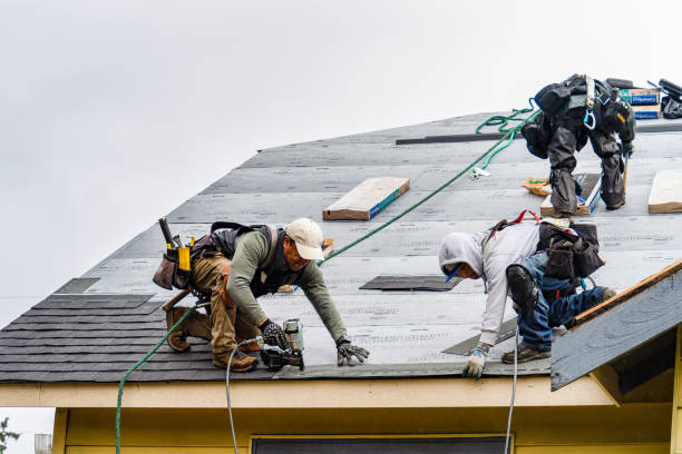 Professional Roofing technician working in Ashby, MA